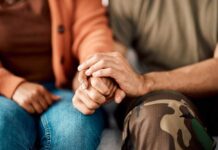 A couple holding hands, showcasing intimacy and support