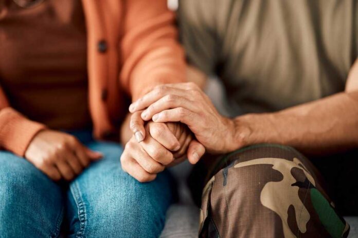 Marriage,,Holding,Hands,And,Couple,On,Sofa,In,Therapy,For A couple holding hands, showcasing intimacy and support