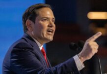 Iran Talks: Rubio Warns Against Premature Celebration A politician passionately delivering a speech at a podium