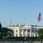 The White House with the Washington Monument in the background