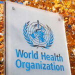 World Health Organization sign with autumn leaves background