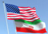 Mystery Ceasefire Terms: The Hidden Risks American and Iranian flags waving in the sky.