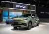 China’s EV Push Sparks Security Fears A green BYD Atto 3 electric vehicle displayed at a car exhibition