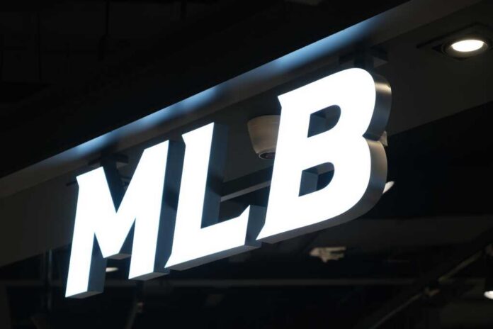 Shanghai,china-feb.,25th,2023:,Mlb,(major,League,Baseball),Brand,Logo,Store Illuminated MLB sign on a dark ceiling