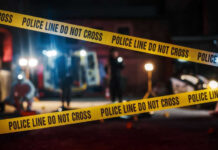 Social Media Murder Narrative Hides Gang Reality Police tape cordons off a nighttime crime scene