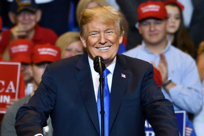 donald-trump-portrait-smiling1155247306jpg smiling man in suit speaking at a rally