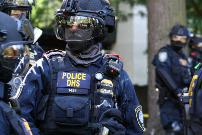 Riot police officer in tactical gear with helmet and visor