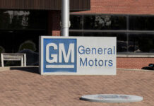 General Motors sign outside a brick building