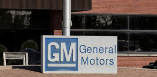 General Motors sign outside a brick building