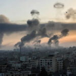 Gaza Waterfront Hit—Facts Still Missing City skyline with rising smoke and birds in sky.