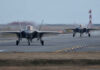 Who Really Controls America’s Fighter Jets? Two F-35 fighter jets on an airfield preparing for takeoff