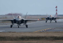 Who Really Controls America’s Fighter Jets? Two F-35 fighter jets on an airfield preparing for takeoff