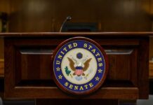 A Senate Showdown Over Security Powers Podium with the United States Senate seal
