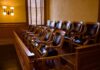 Track Meet Turns Deadly—Jury Drops Hammer Empty jury box with wooden chairs in a courtroom