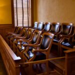 Track Meet Turns Deadly—Jury Drops Hammer Empty jury box with wooden chairs in a courtroom