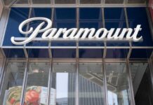 Price Hike Warning Hits Paramount–Warner Deal Paramount sign displayed on a building exterior