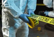 Eat Ants? Or Media Hype Gone Wild? forensic investigators unrolling yellow barrier tape at night