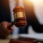 Religious-Liberty Beatdown: State Pays Up A gavel being struck on a desk in a courtroom setting