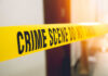 Yellow crime scene tape with the words 'CRIME SCENE DO NOT CROSS'