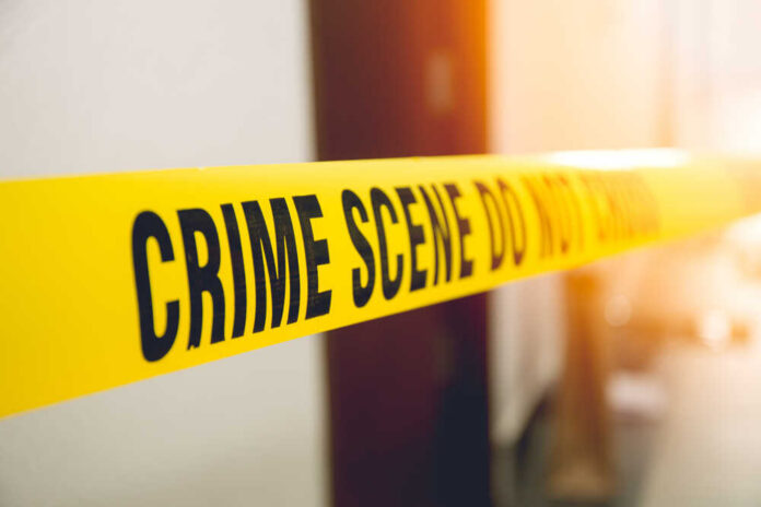 Crime,Scene,Tape,In,Front,Room,Door,With,Flare,And Yellow crime scene tape with the words 'CRIME SCENE DO NOT CROSS'