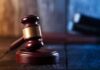 Judge's gavel resting on wooden block