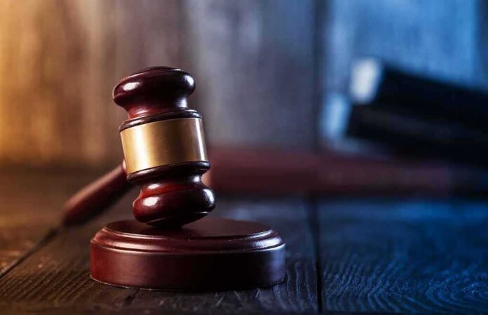 Judge's gavel resting on wooden block