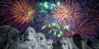 Fireworks exploding over Mount Rushmore at night