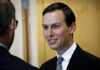 Drug Money Allegations Shake Kushner Resort Deal A man in a suit smiling while engaging in conversation indoors