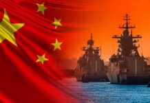 Chinese Vessel Confronts Philippine Patrol Near Shoal Chinese flag overlaid on warships at harbor during sunset