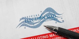 Official election mail envelope with pen