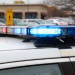 The Parking Lot Discovery Shocked Officers Close-up of a police car's emergency lights in a parking lot
