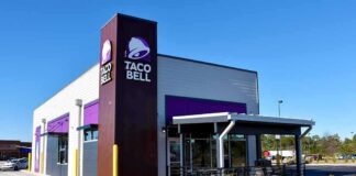 Taco Bell restaurant exterior with drive-thru and patio seating