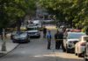 Fatal Madison Police Shooting Sparks Public Protests Police officers secure a residential street with patrol cars and yellow tape