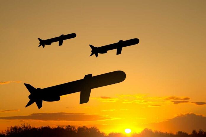 Silhouettes,Of,Tomahawk,Cruise,Missiles,Against,The,Sunset Silhouettes of missiles flying against a sunset backdrop