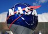 Hell Planet Breathes — Scientists Stunned NASA logo displayed on a large globe structure