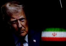 Nightly Bombing Escalates — Trump Draws Hard Line Close-up portrait of a man with a serious expression, with the Iranian flag in the background
