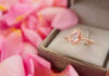 Scientists Unlock Gold’s Hidden Advantage Rose gold halo ring in a jewelry box among pink petals