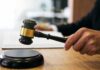 Tax Grab Backfires—Now Come the Refunds Judge's hand holding a gavel over a sound block