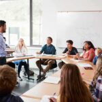 The College Readiness Crisis Hits Elite Campuses Teacher speaking to students in a classroom discussion