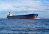 New Hormuz Deal Could Test America’s Red Lines A large cargo ship sailing on the ocean under a blue sky