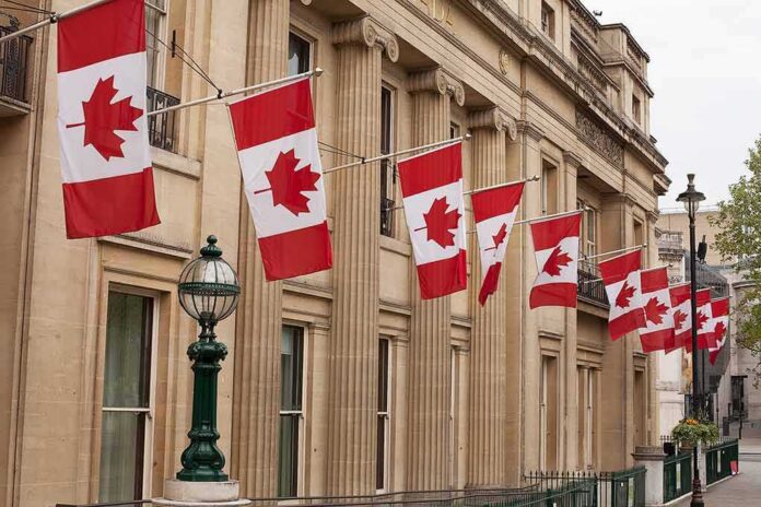 Canadian flags on a neoclassical building facade