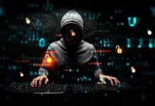 hooded figure typing on dual keyboards amid glowing code
