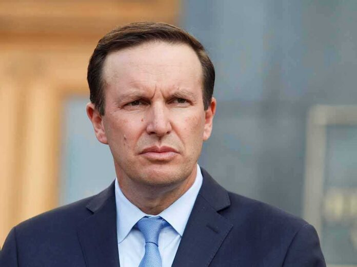 Man in suit and tie outdoors with serious expression