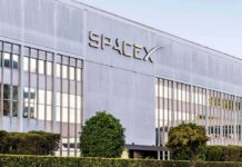 SpaceX headquarters exterior with large logo and windows