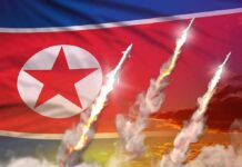 North Korean flag with missiles launching and smoke trails