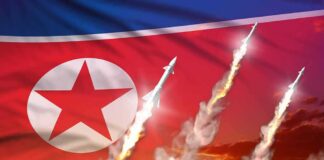 North Korean flag with missiles launching and smoke trails