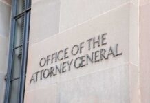 Blanche’s DOJ Bid Survives by the Skinniest Margin Office of the Attorney General building sign on stone wall