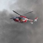 Daring Rescue Unfolds 600 Feet Below Safety Rescue helicopter hovers amid thick smoke