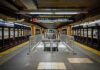 Subway platform with stairwell and tracks on both sides