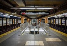Subway platform with stairwell and tracks on both sides